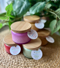 Load image into Gallery viewer, A Group of the colorful, 4 oz embossed jar candles from Bungalow's Classic Collection