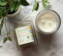 Load image into Gallery viewer, Coeur d'Alene Fountain Flora Candle from Bungalow's Spring and Summer Collection shown in 12 oz double glass colored jar.
