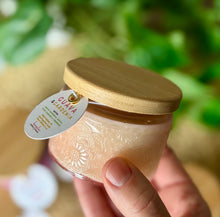 Load image into Gallery viewer, The Guava & Gardenia scent from Bungalow's Classic Collection shown in the cute 4oz peach-colored embossed jar.