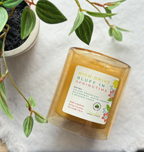 Load image into Gallery viewer, High Drive Bluff in Springtime Candle from the Spring and Summer Collection shown in yellow 12 ounce glass jar laying down.