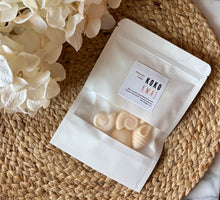 Load image into Gallery viewer, Sea shell shaped wax melts from the Coastal Collection in a resealable package. Koko Kwaj scent shown.
