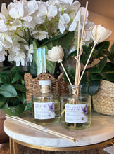 Load image into Gallery viewer, Reed Diffuser with floral reeds from the Spring and Summer Scent Collection in Lilac Legacy of Spokane scent.