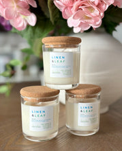 Load image into Gallery viewer, 3 Linen & Leaf mini 4 oz candles from the Classic Collection stacked on top of each other.