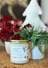 Load image into Gallery viewer, The Midnight Snow on Grand scent in a glass jar with gold lid from Bungalow's Winter Candle Collection.