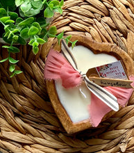 Load image into Gallery viewer, Heart-shaped dough bowl candle with a pink bow on a woven surface with greenery.