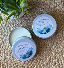 Load image into Gallery viewer, Mountains Out in Seattle Travel Candle in a 2oz white tin Bungalow Seattle Collection