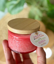 Load image into Gallery viewer, The Peony & Nectar scent from Bungalow's Classic Collection shown in the cute 4oz pink-colored embossed jar.