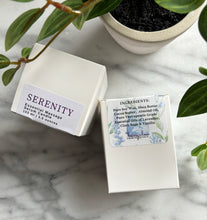 Load image into Gallery viewer, Two boxes of the serenity massage serum candle showing ingredients