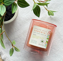 Load image into Gallery viewer, South Hill Sangria Candle from the Spring and Summer Collection shown in pink 12 ounce glass jar laying down.