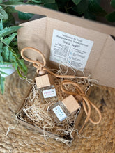 Load image into Gallery viewer, Two Bungalow car diffusers in a cardboard box ready to give