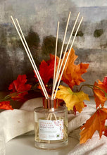 Load image into Gallery viewer, Spokane Sweater Weather Reed Diffuser in use sitting on table.
