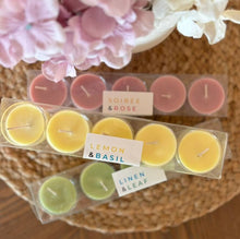 Load image into Gallery viewer, Three packages of tealight candles in scents from the Classic Collection, stacked on top of each other.