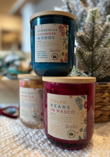 Load image into Gallery viewer, 10 oz colored holiday jar candles in the Fall and Winter Tri-Cities Collection, stacked together.