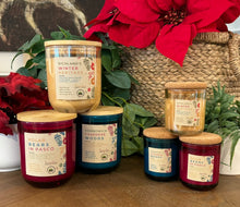 Load image into Gallery viewer, 10 oz holiday jars next to the 4 oz holiday jars to show difference in size for the Tri-Cities Candle Collection