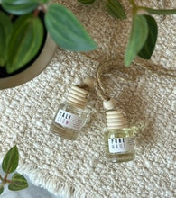 Load image into Gallery viewer, Two car diffusers from the coastal scent collection are shown side by side.