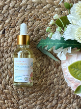 Load image into Gallery viewer, Glass bottle with eye dropper lid in the scent of Waikiki Spring Trailhead, sitting on a textured mat.