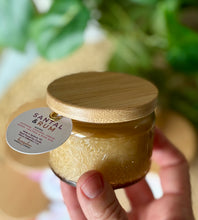 Load image into Gallery viewer, The Santal & Rum scent from Bungalow's Classic Collection shown in the cute 4oz gold-colored embossed jar.