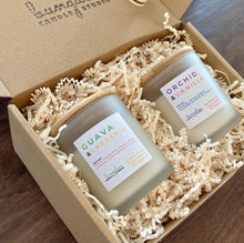 Load image into Gallery viewer, Two candles placed in a box as an example of the Duo Gift Set.