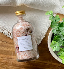 Load image into Gallery viewer, Apothecary jar with bath salts and dried botanicals on a wood table and textured white cloth