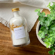 Load image into Gallery viewer, Apothecary jar with bath salts and dried botanicals on a wood table and textured white cloth