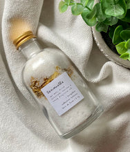Load image into Gallery viewer, Apothecary jar with bath salts and dried botanicals on a textured white cloth