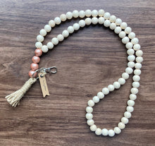 Load image into Gallery viewer, Mango wood bead lanyard with natural beige colored beads and rose gold accent beads.