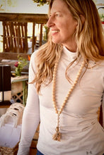 Load image into Gallery viewer, Sue, owner of Bungalow Candle Studio, wearing a mango wood bead teacher lanyard.