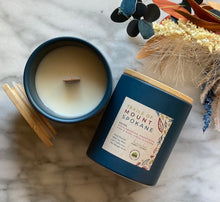 Load image into Gallery viewer, The Trails of Mount Spokane scent from the Fall Candle Collection is shown in a beautiful deep blue colored ceramic jar.