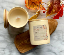 Load image into Gallery viewer, The Vanilla Pumpkin Spice scent from the Fall Candle Collection is shown in a beautiful cream colored ceramic jar.