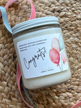 Load image into Gallery viewer, The Congrats soy wax candle from the Bungalow Celebration Collection  in the 8 oz glass jar.

