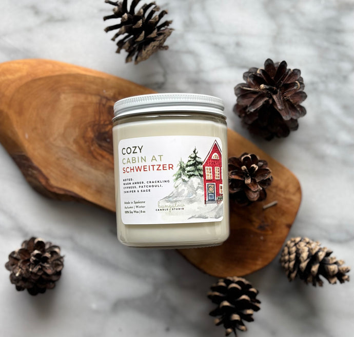 Cozy Cabin at Schweitzer soy wax candle in 8oz size clear glass jar with white tin lid - Bungalow North Idaho Collection