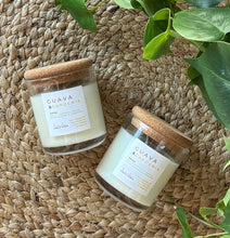 Load image into Gallery viewer, 2 Guava &amp; Gardenia mini 4 oz candles from the Classic Collection next to each other on a woven mat
