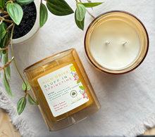 Load image into Gallery viewer, High Drive Bluff in Springtime Candle from the Spring and Summer Collection shown in yellow 12 ounce glass jar.
