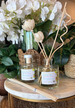 Load image into Gallery viewer, Reed Diffuser with floral reeds from the Spring and Summer Scent Collection in High Drive Bluff in Springtime scent.
