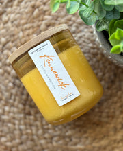 Load image into Gallery viewer, The Kennewick Scent from the Tri-Cities Spring and Summer Collection, shown in a yellow, hand-blown bubble glass jar.
