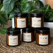 Load image into Gallery viewer, Five of the Kitchen Collection Soy Candles in 4oz size in amber glass jars with black metal lids displayed and made by Bungalow Candle Studio
