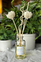 Load image into Gallery viewer, The Lemon and Basil Scent in a reed diffuser from the Classic Collection shown with floral wood reeds.
