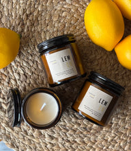 Load image into Gallery viewer, Lemon Soy Candle in amber glass jar with black metal lid in 4oz size made by Bungalow Candle Studio
