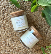 Load image into Gallery viewer, 2 Lemongrass &amp; citrus mini 4 oz candles from the Classic Collection next to each other on a woven mat
