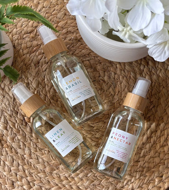Three bottles of Linen Sprays from the Classic Scent Collection.