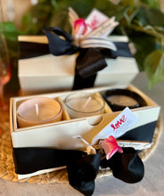 Load image into Gallery viewer, Three candles in different colors in cream linen box with black satin ribbon
