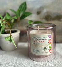 Load image into Gallery viewer, Manito Park High Noon Blooms Candle from the Spring and Summer Collection shown in a single upright purple 12 ounce double glass jar.
