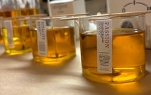 Load image into Gallery viewer, Massage candle oil, setting in glass jar
