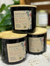 Load image into Gallery viewer, 3 Dark blue candle jars in the Midnight Snow on Grand scent stacked on a table
