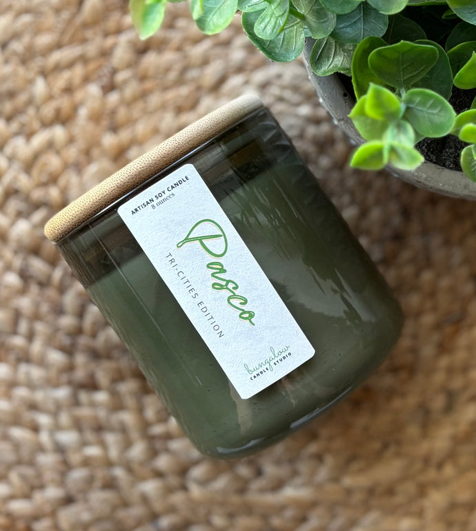 The Pasco Scent from the Tri-Cities Spring and Summer Collection, shown in a green, hand-blown bubble glass jar.