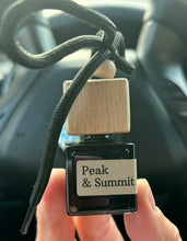 Load image into Gallery viewer, The Peak &amp; Summit scent from the Cascade Collection in a car diffuser.
