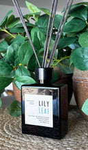 Load image into Gallery viewer, Wood Reed Diffuser in black glass container in Lily Leaf Scent
