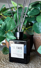Load image into Gallery viewer, Wood Reed Diffuser in black glass container in Taos Sage Scent
