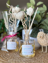 Load image into Gallery viewer, Reed Diffuser with floral reeds from the Spring and Summer Scent Collection in Waikiki Springs Trailhead scent.
