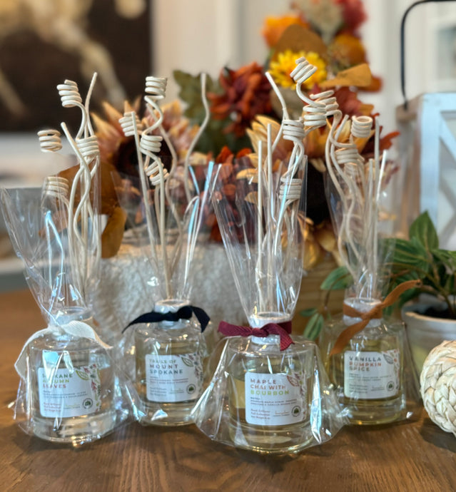 A group of reed diffusers in fall scents.